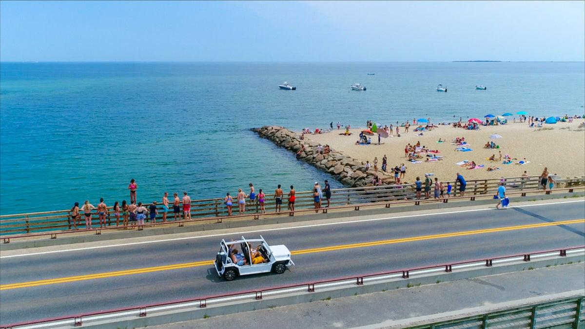 Moke crossing a bridge with passengers