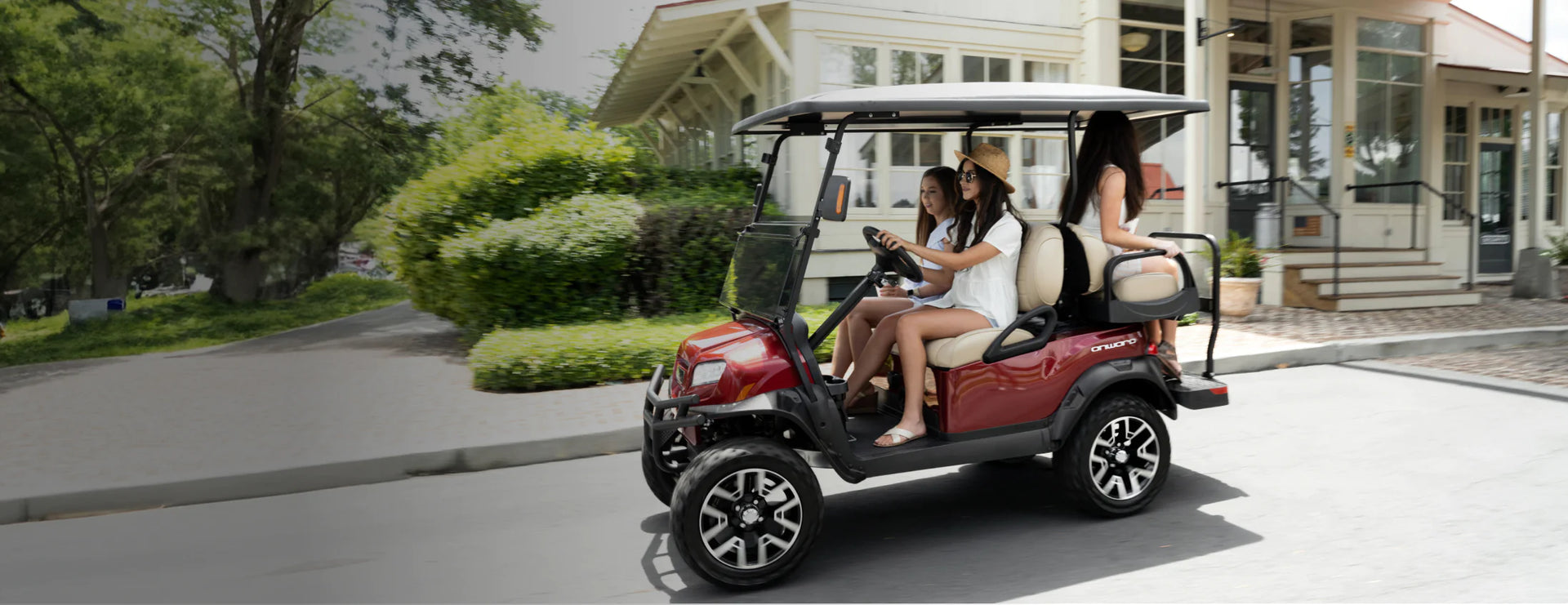 Women enjoying a ride in a C2 golf cart
